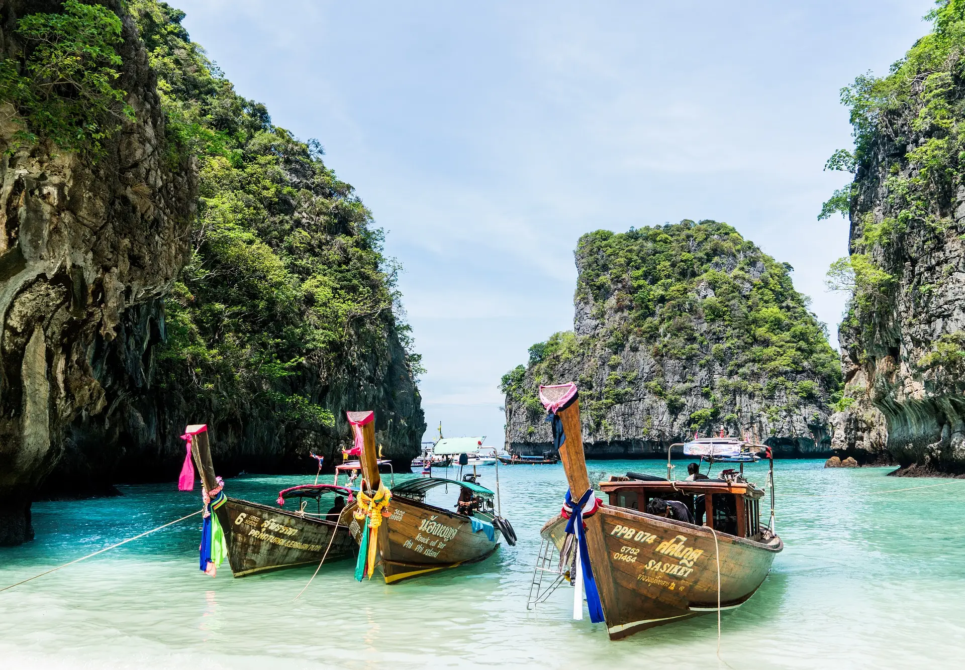 Long tail boats in Phuket among small islands in Thailand